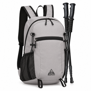 Gray EasiCyco packable backpack shown at an angle with trekking poles secured to the side